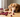dog uti symptoms dog with cranberries sitting on table looking concerned